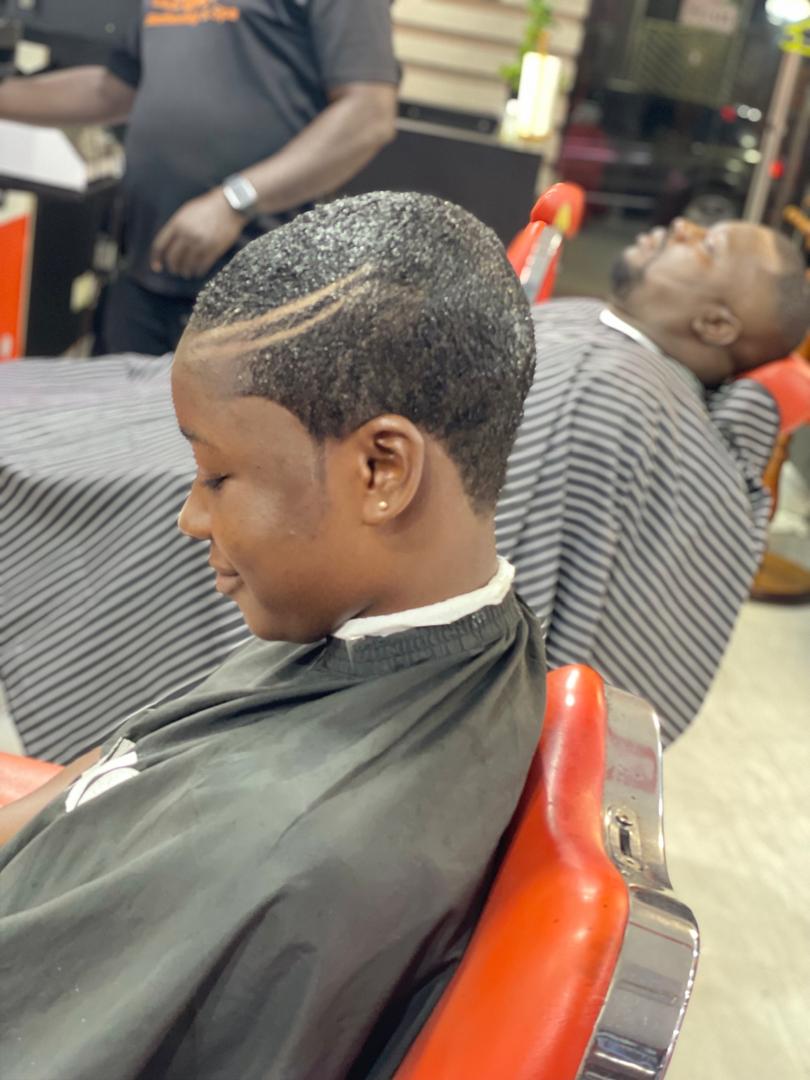 Female client showcasing a clean natural crop cut setup