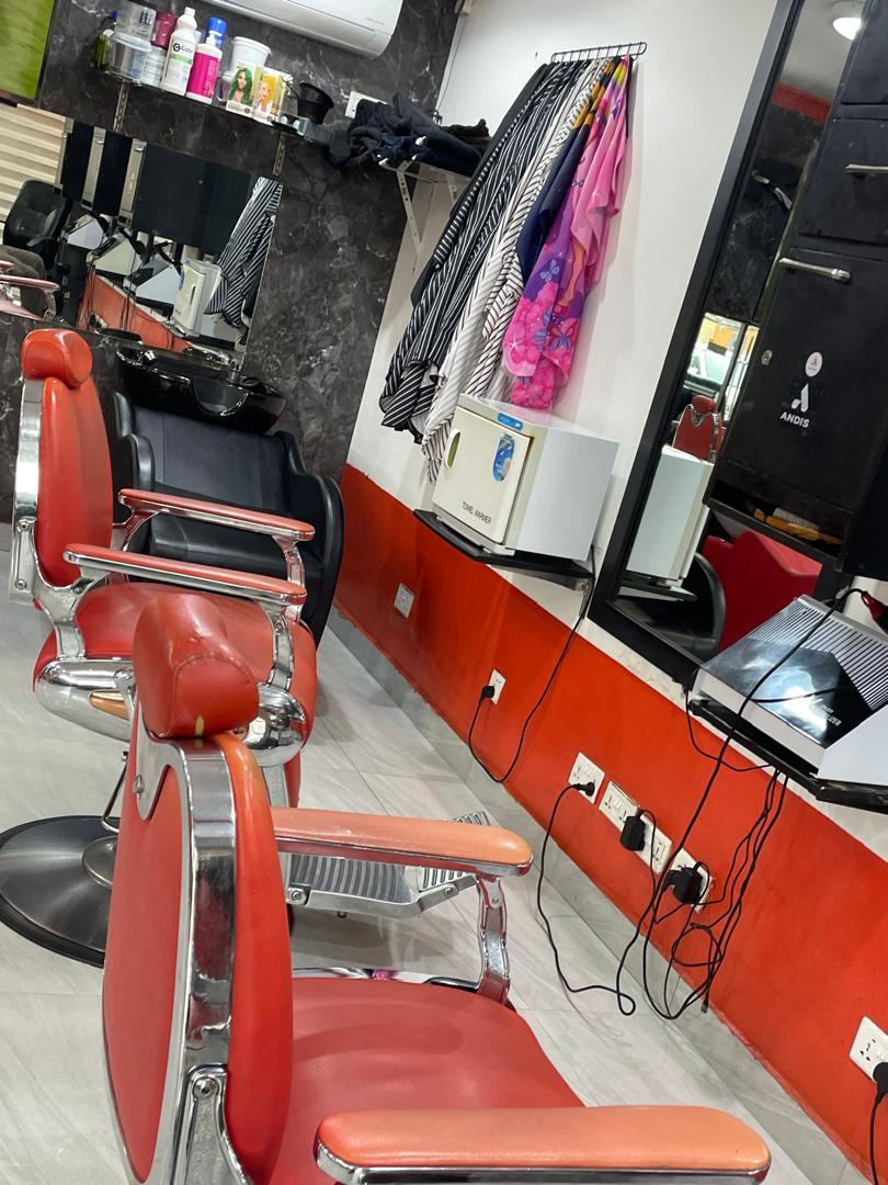 Modern workspace with retro red leather styling chairs and wash basin