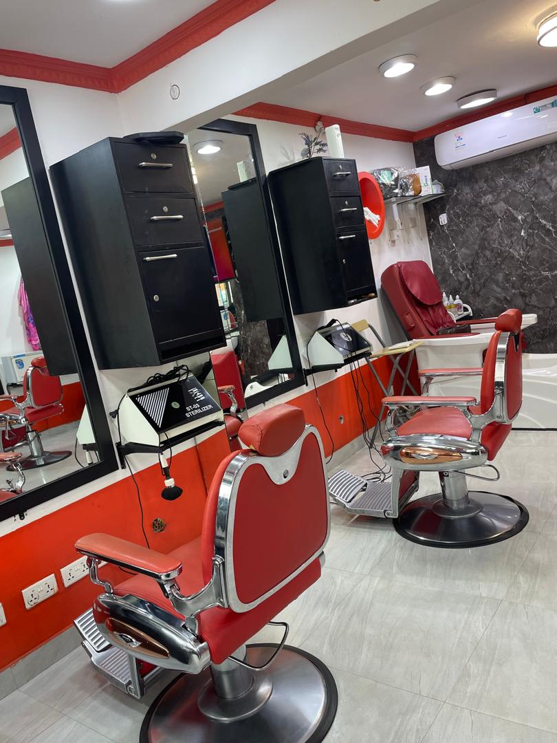 Cherry red pedicure spa station and chrome styling chairs